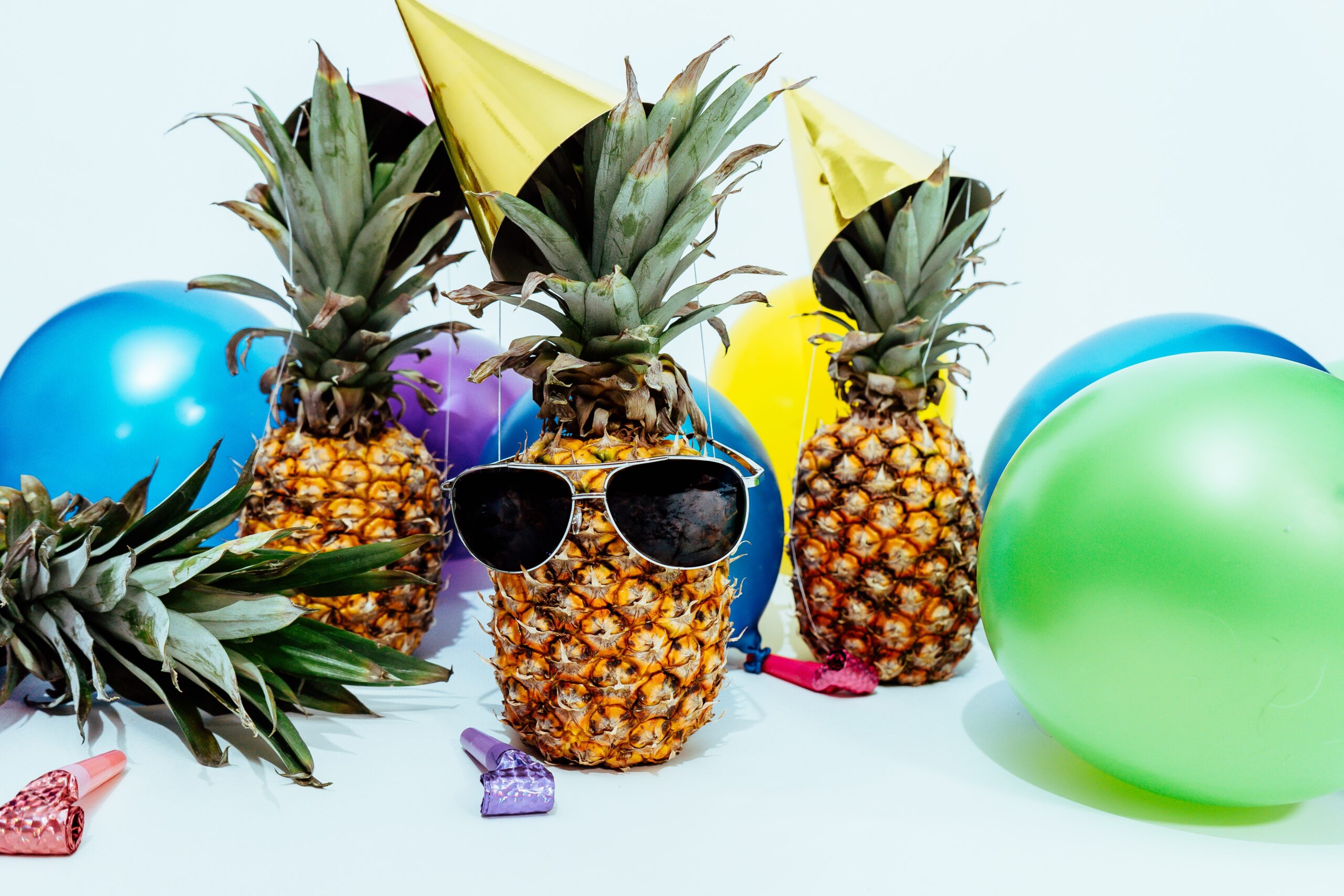 Pinapple wearing sunglasses at a party